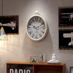 Menterry Oval Retro Wall Clock, Rustic Vintage Style, White Antique Design, Battery Operated Silent Decor Large Wall Clocks for Kitchen,Farmhouse,Office (15.5" H x 10.5" W)