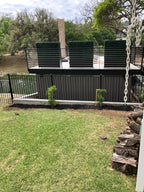 Artificial Boxwood Hedge Divider Wall with Black 201 Stainless Steel Planter Box (60" L X 48" H X 14" D)