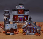 Mark Feldstein & Associates Spooky Halloween Color Changing Pre-Lit LED Haunted House Village Set, 8 Inch, Set of 3